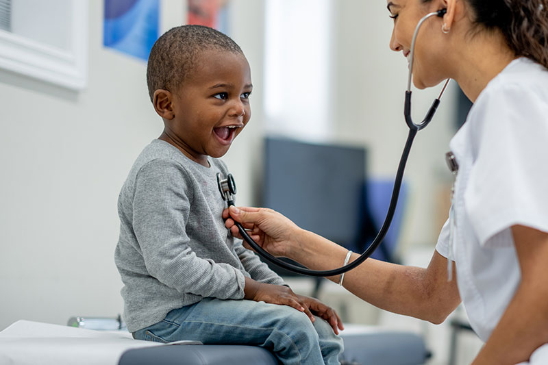 Child smiling at a doctor